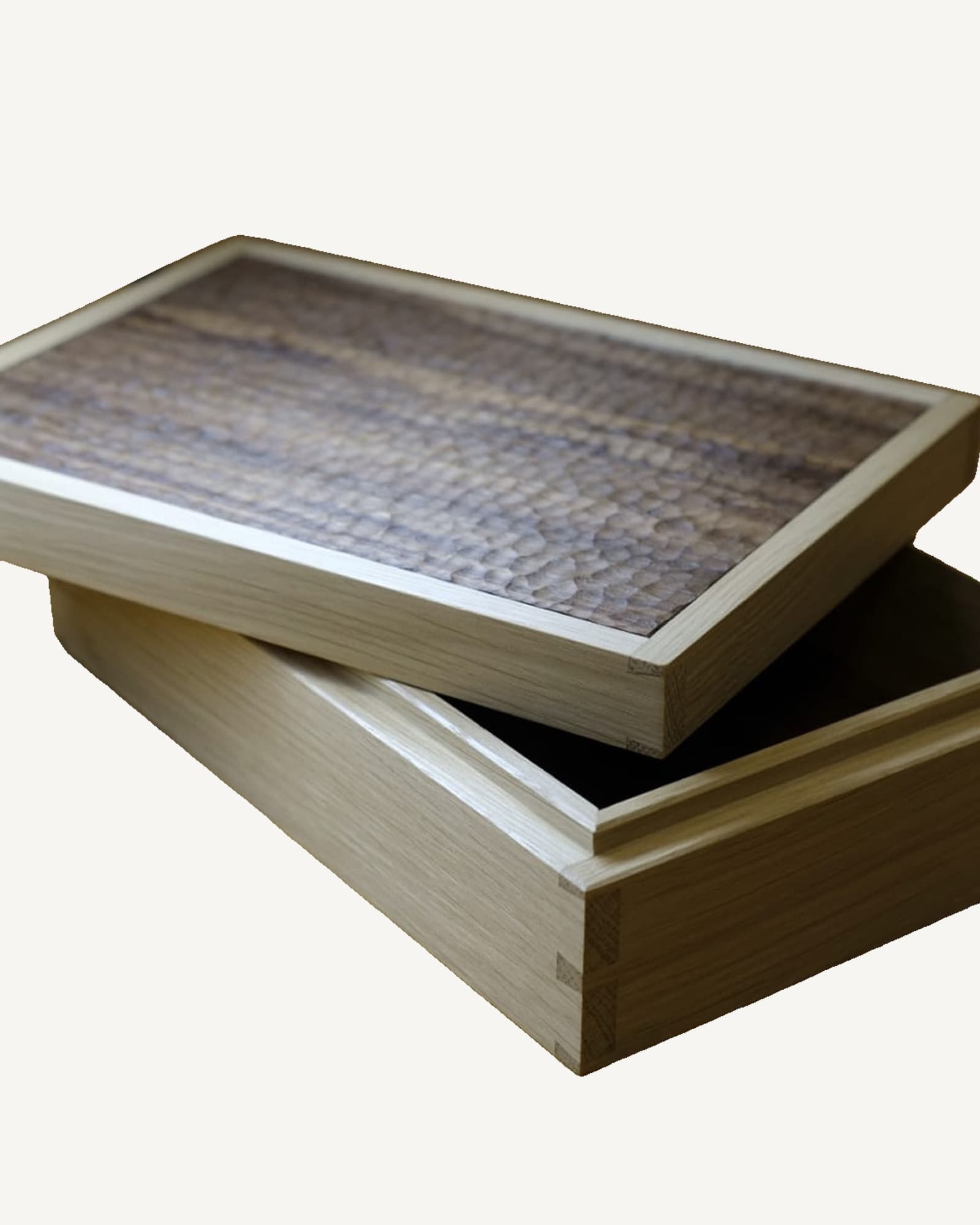 Oak dovetailed box with sliding lid, featuring hand-carved walnut top with textured surface pattern, natural wood grain