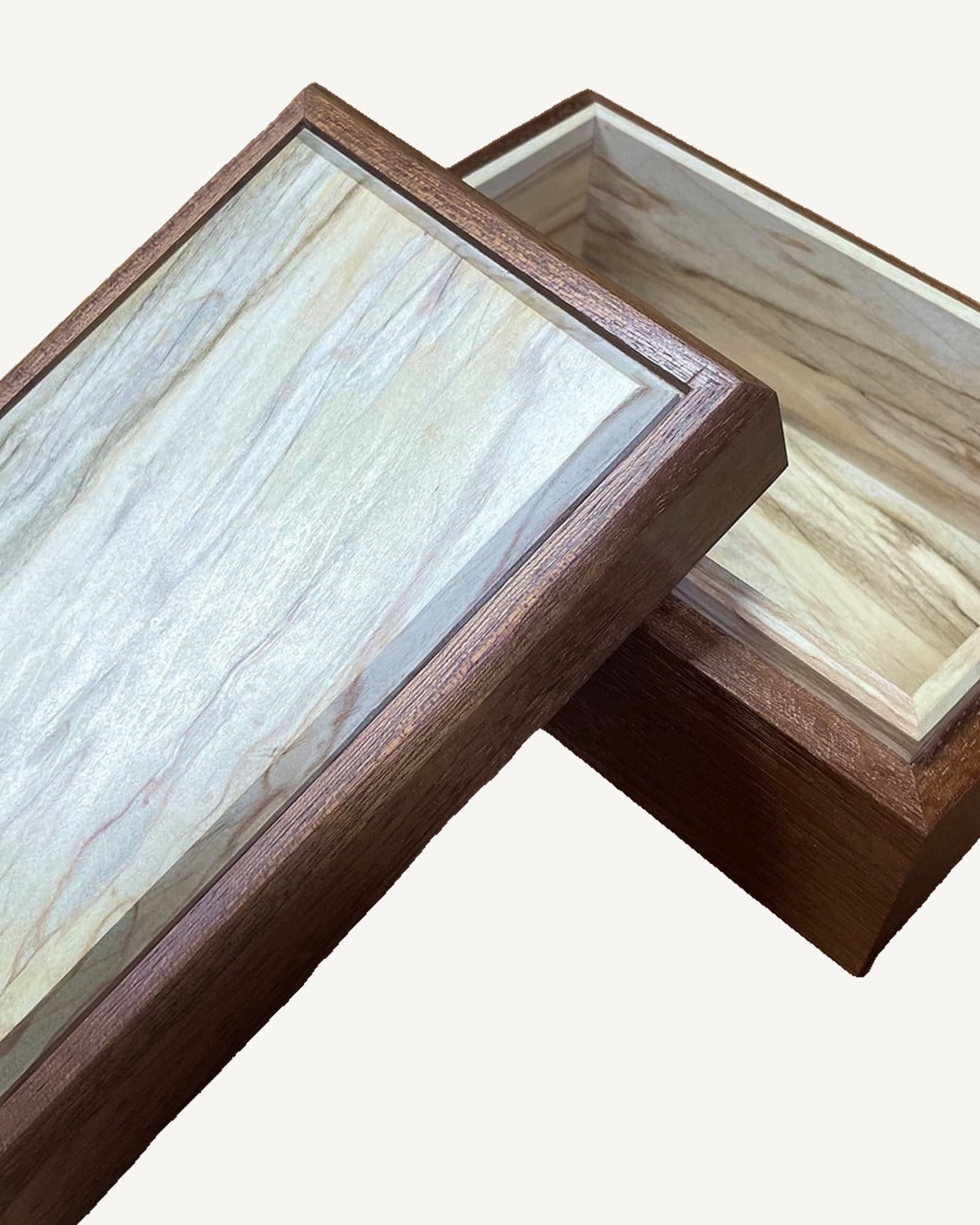 Dark sapele wooden box with spalted sycamore lid showing grey and cream grain patterns, angled corner detail visible.