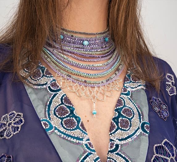 Detail of the Night Sun necklace, seventeen rows of glass and semiprecious beads at the throat