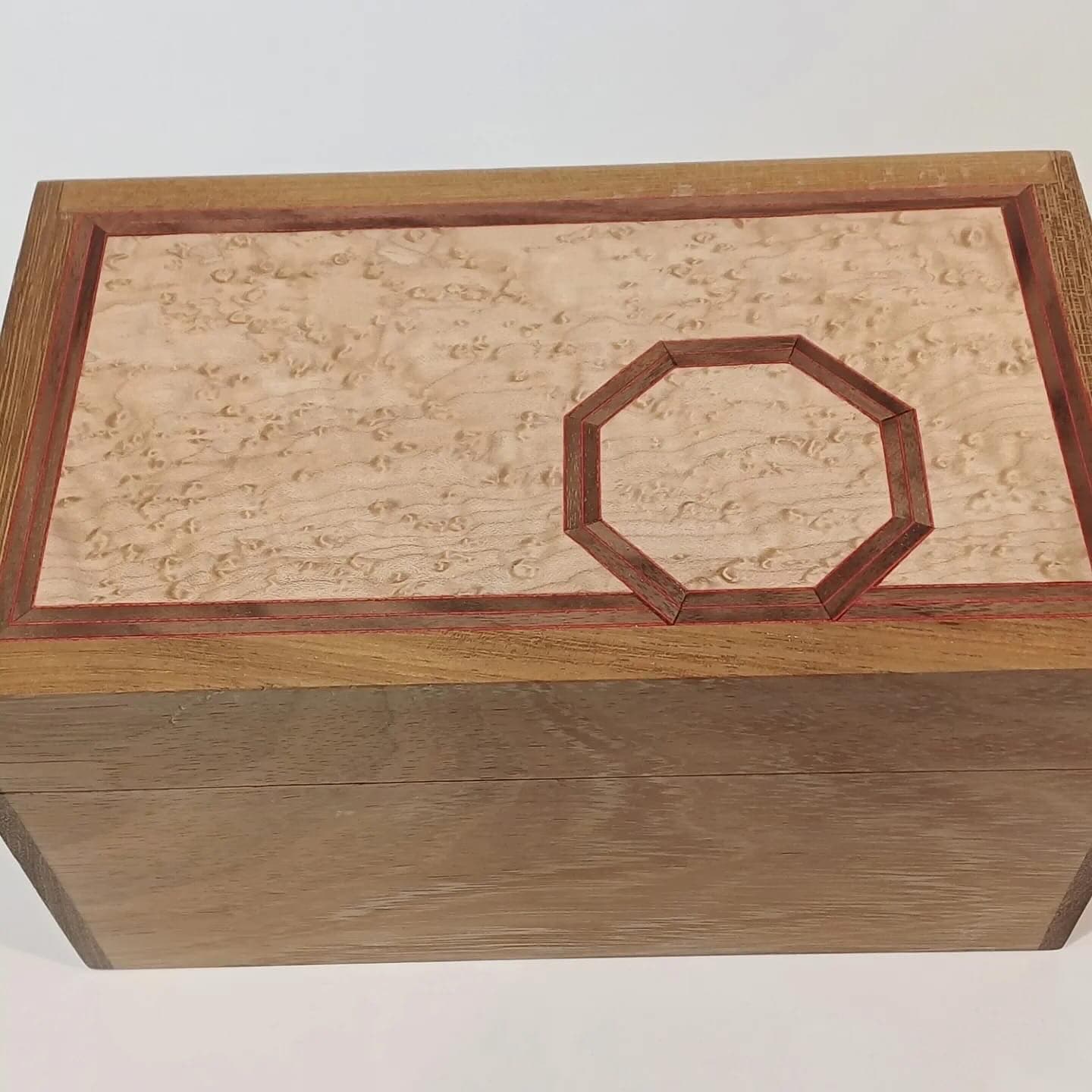 The lid seen from above, the octagon centred on the speckled panel inside a darker frame.