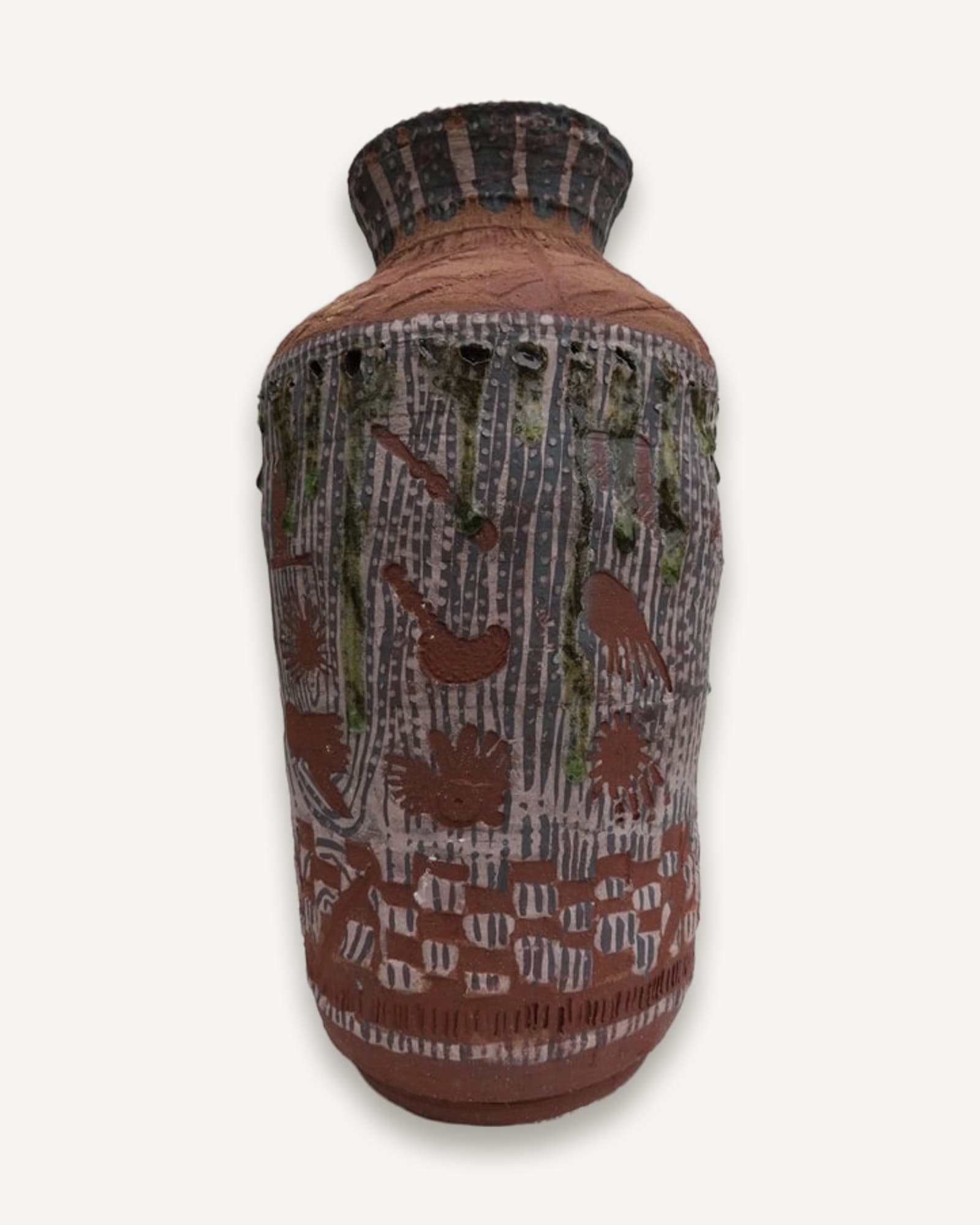 A wood-fired ceramic vessel with vertical carved decoration