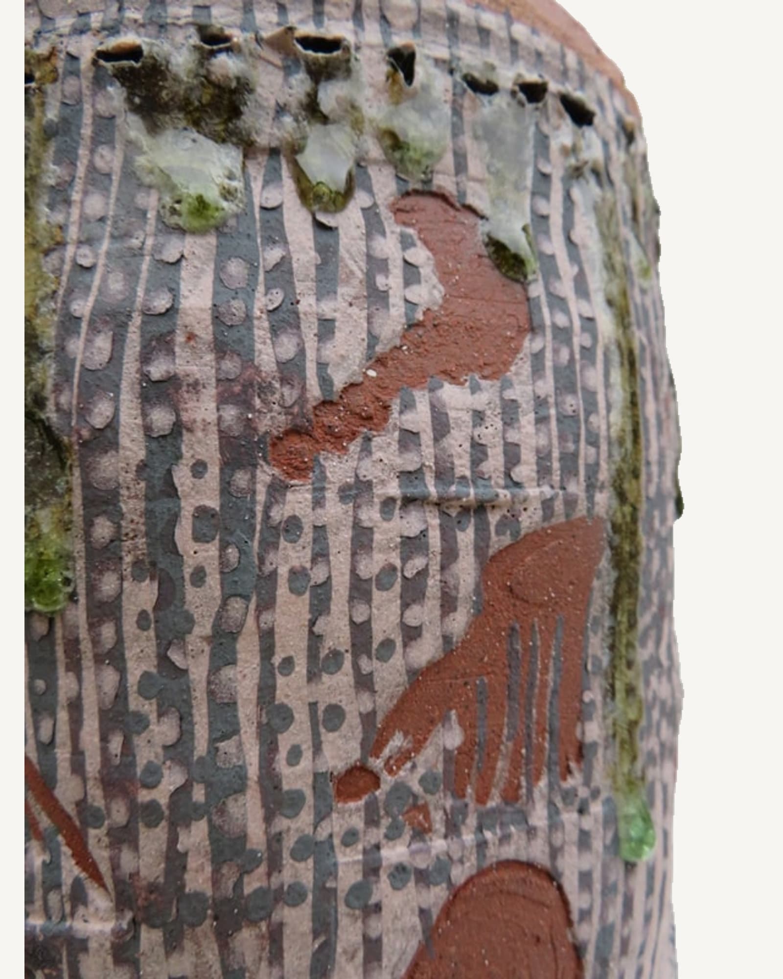 Detail of carved and slip-decorated surface on a wood-fired vessel