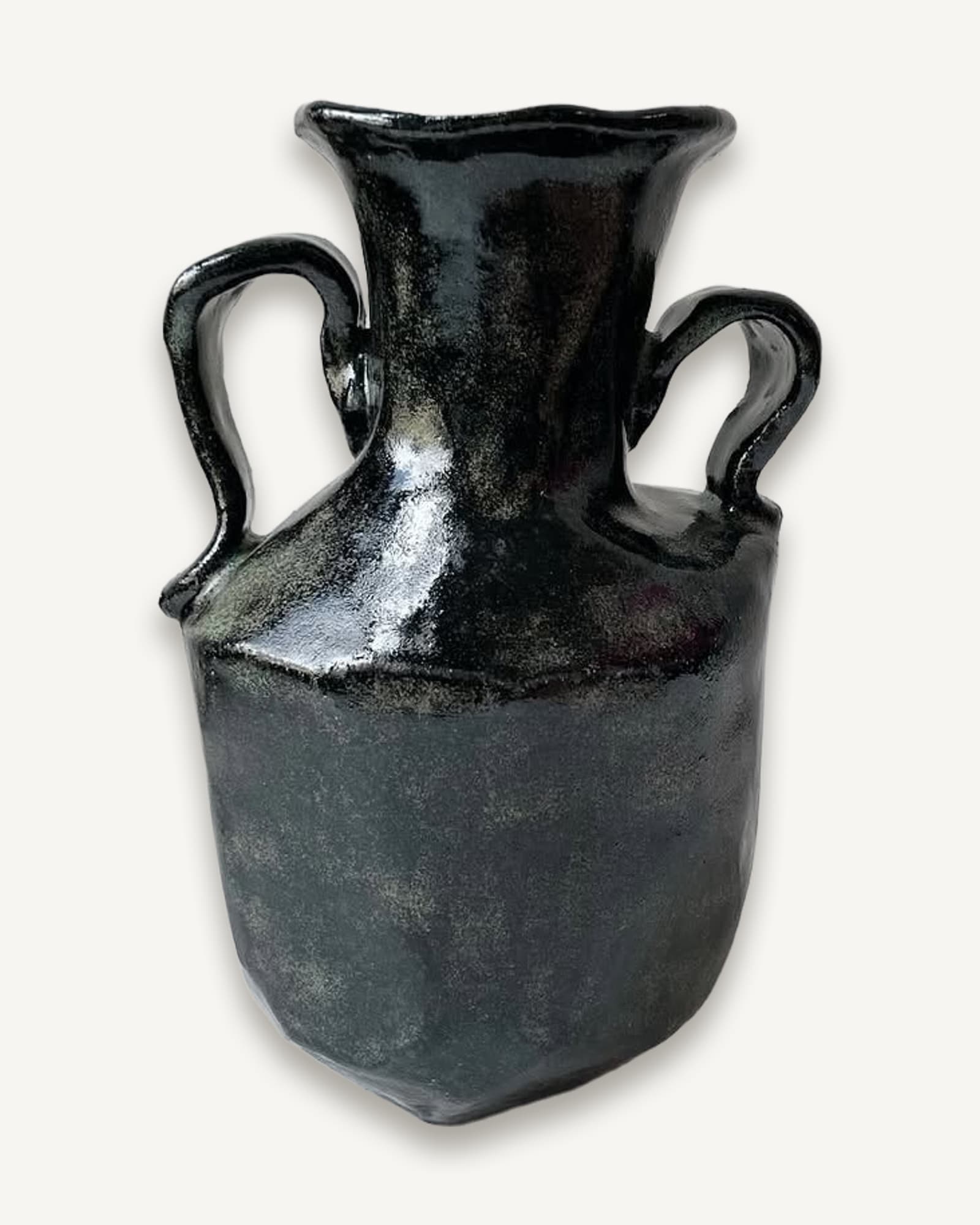 Black clay vessel with flared rim and two curved handles, glossy dark glaze on upper half fading to matte lower body.