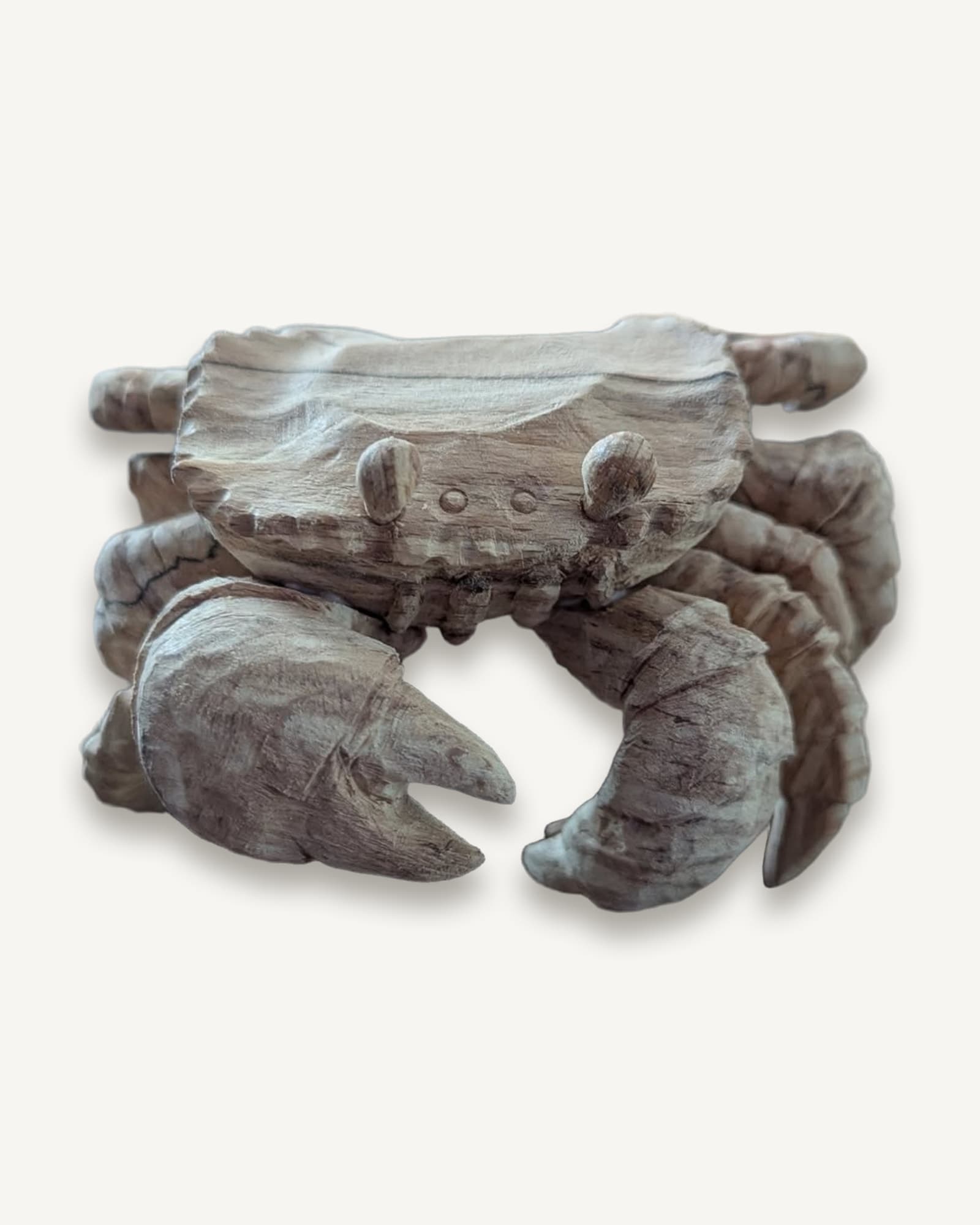 Carved spalted beech crab with raised claws and a faceted shell