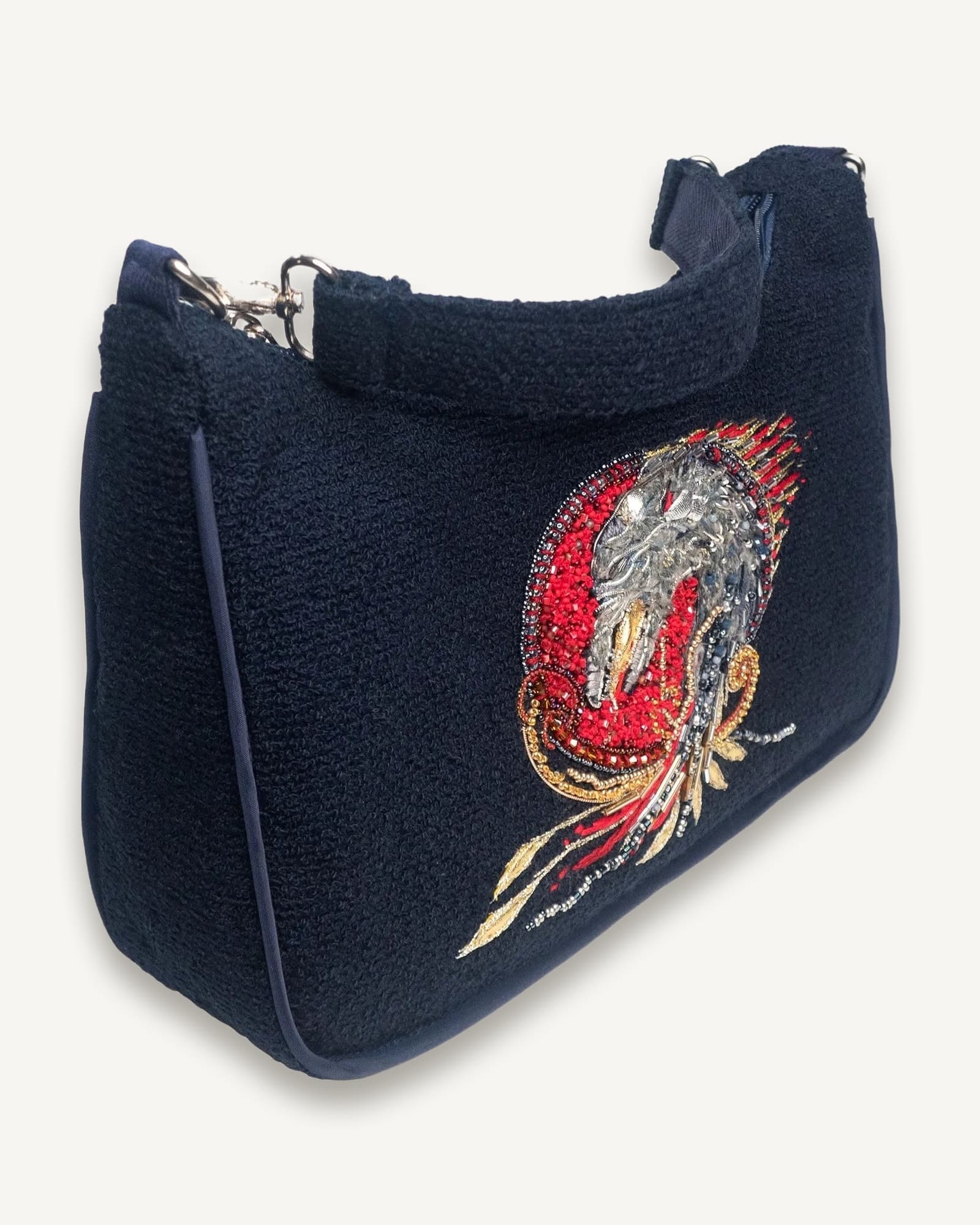 Handcrafted mini bag with dragon embroidery design by ByRova, designed and handmade by Ksenia Semirova, angled view showing detailed embellishment