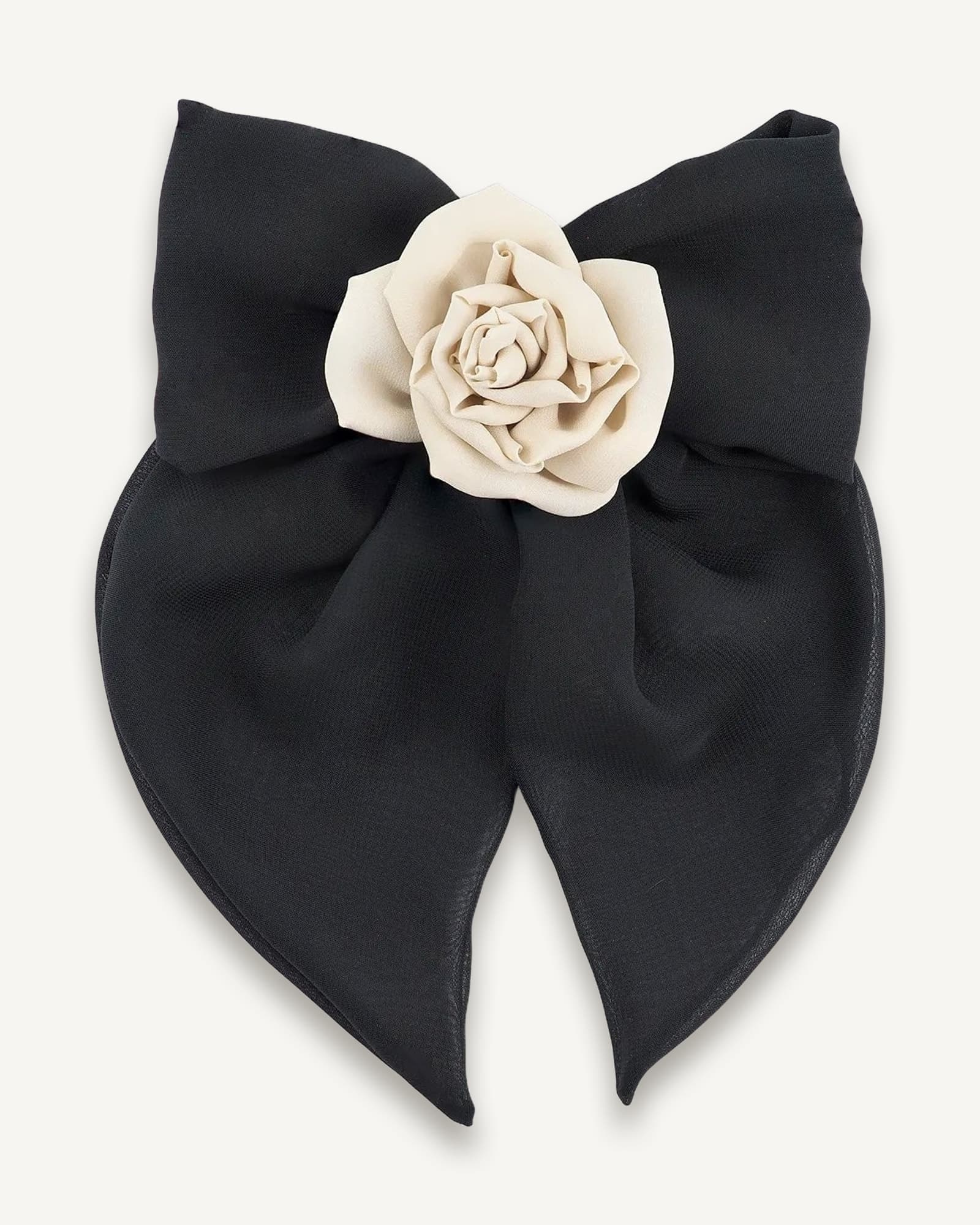 Front view of a black chiffon bow hair clip featuring a handmade nude chiffon rose centerpiece, ideal for stylish and versatile hair looks