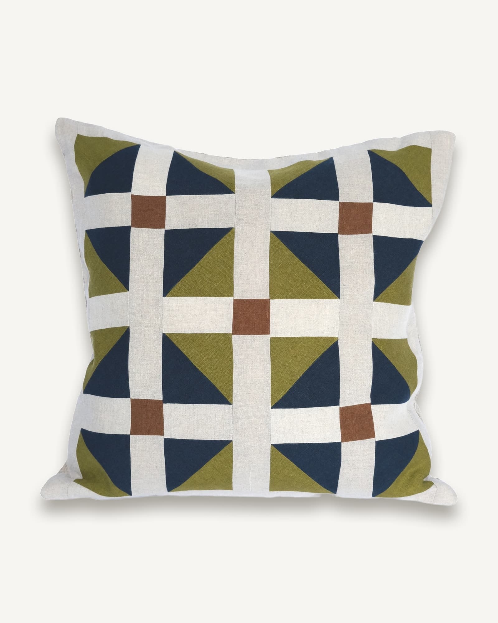 Linen cushion with tessellating patchwork tiles in olive, navy and rust on natural linen
