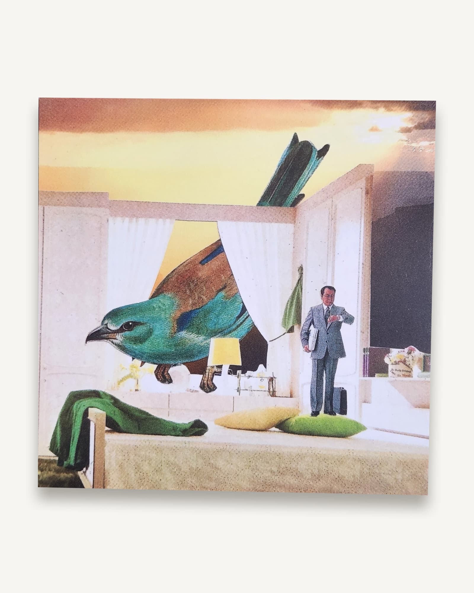 A square printed postcard of a collage setting an oversized bird inside a period interior, scale deliberately wrong.