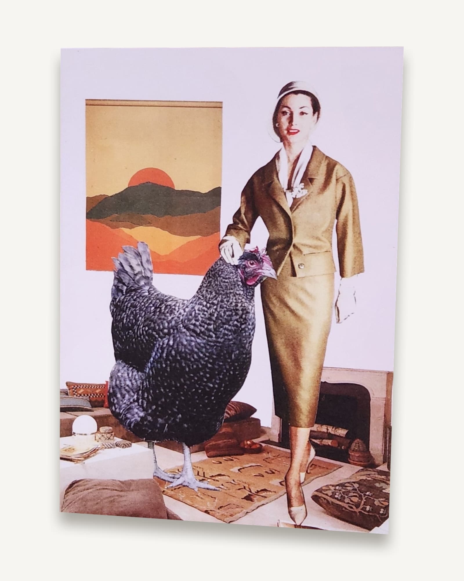 A printed A6 card of a collage of an oversized chicken indoors, made for a friend with a way with chickens.