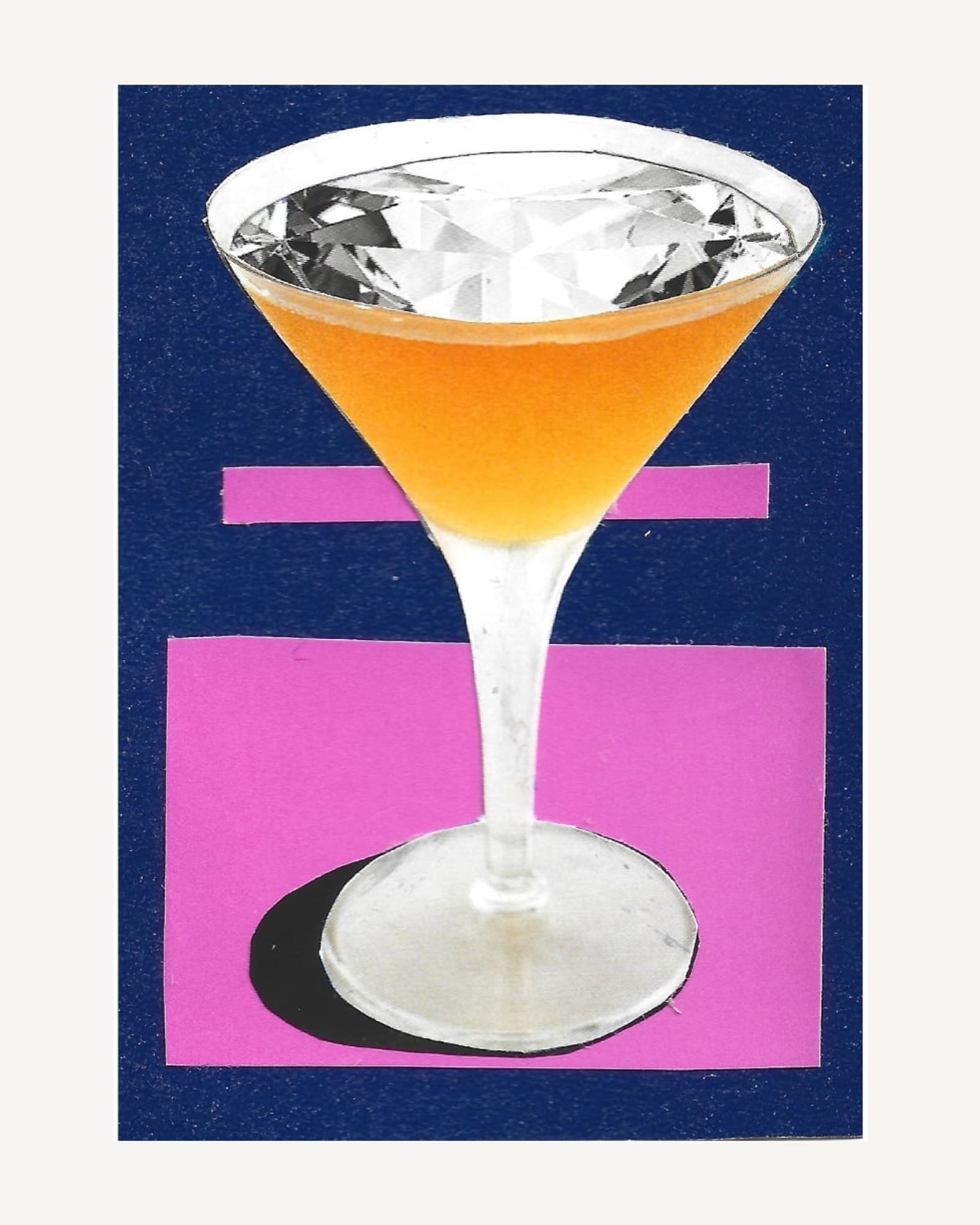 A cut diamond floating on an orange cocktail in a coupe glass, hand-cut on navy and pink card.