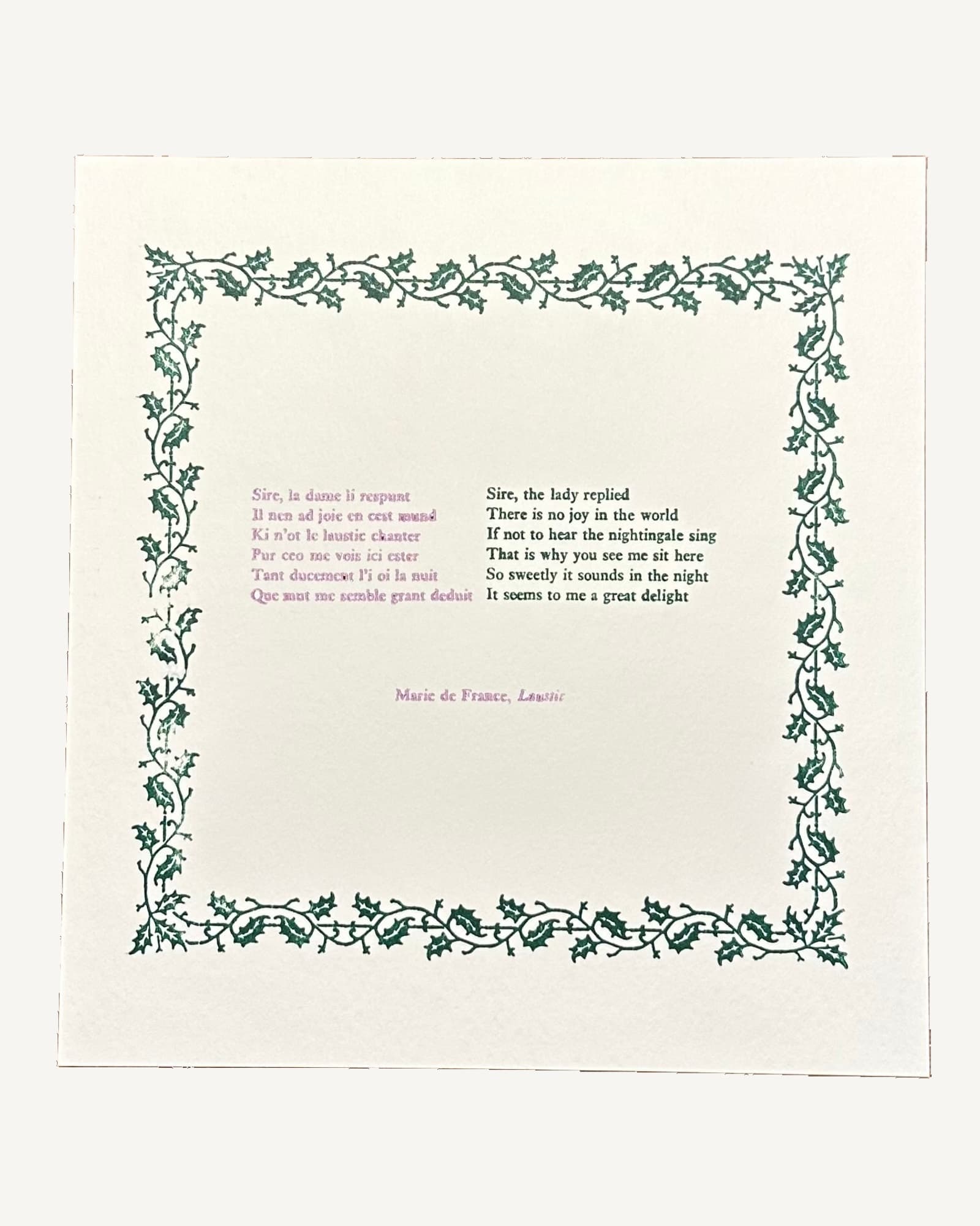Cream page with green ivy leaf border frame containing pink and black printed text of a medieval poem about a nightingale