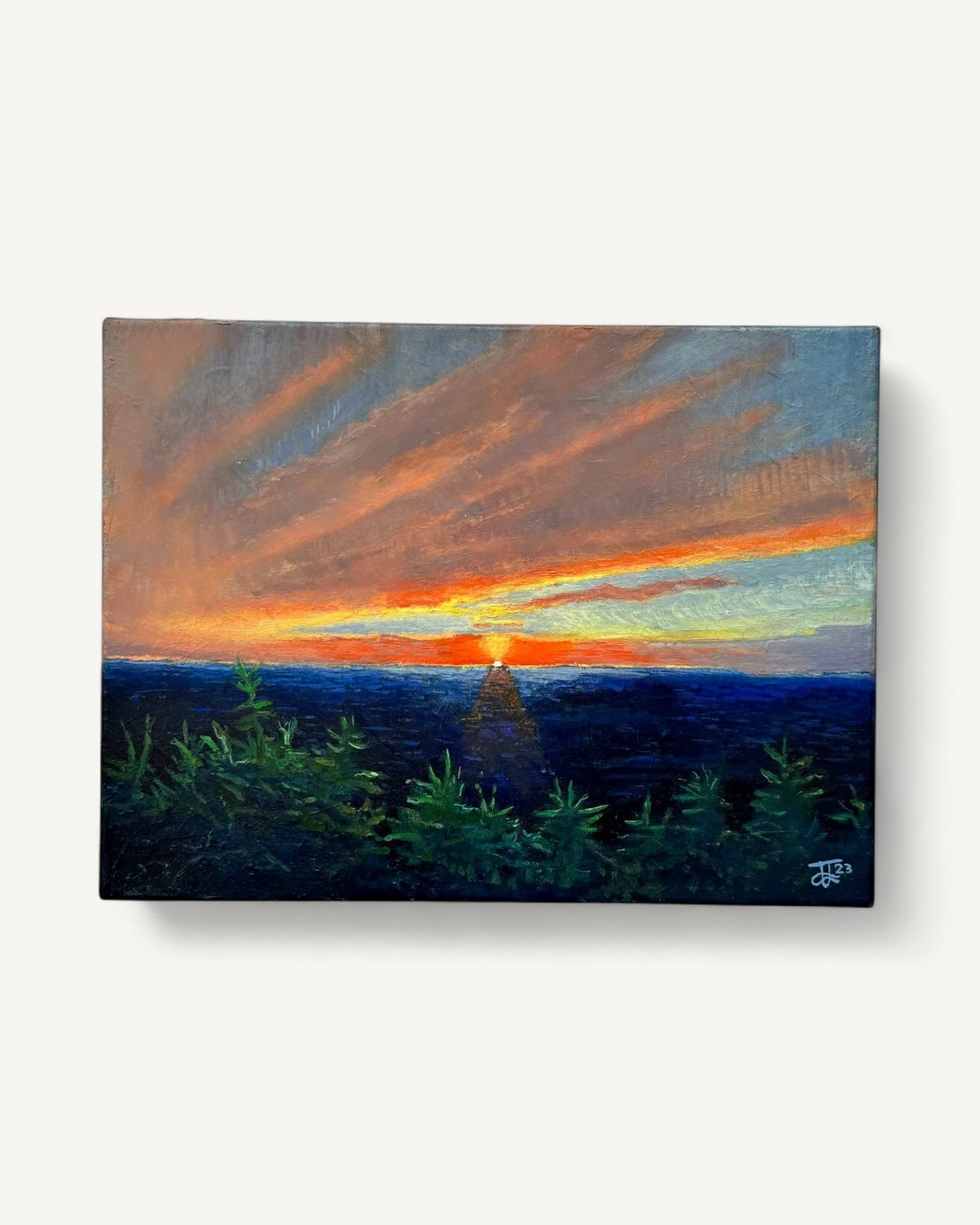 Oil painting of sunset over water with radiating orange and golden light above deep blue sea, green vegetation silhouetted