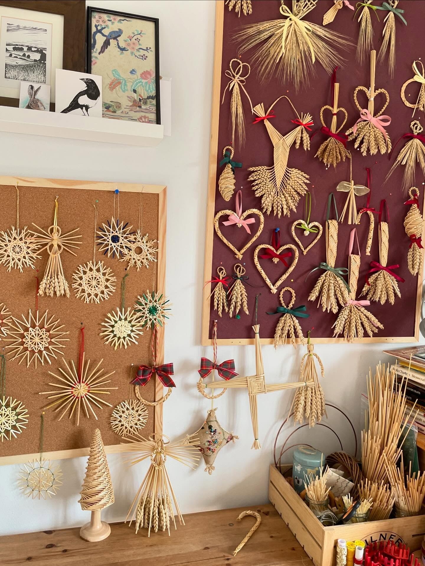Boards of hanging straw work prepared for a craft market at Sudbury Arts Centre