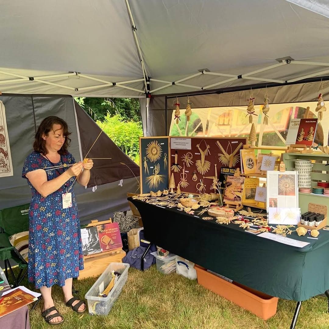Lucy Hook-Child plaiting straw at her stall at the Essex County Craft Show