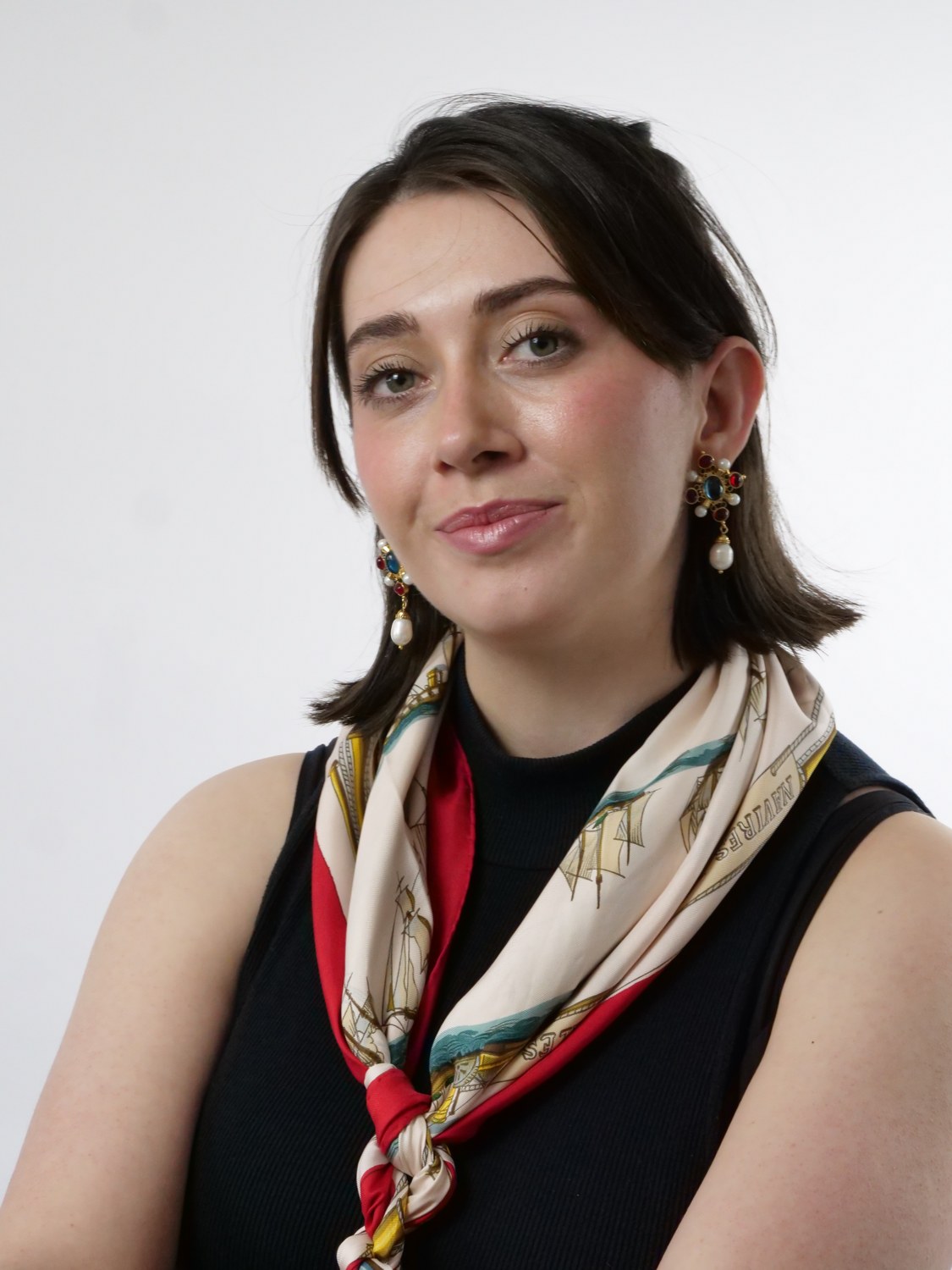 Rosie Thompson, founder of The Haud, in a black top with a vintage nautical-print silk scarf