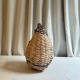 Load image into Gallery viewer, Woven vase on a white surface with a neutral curtain background
